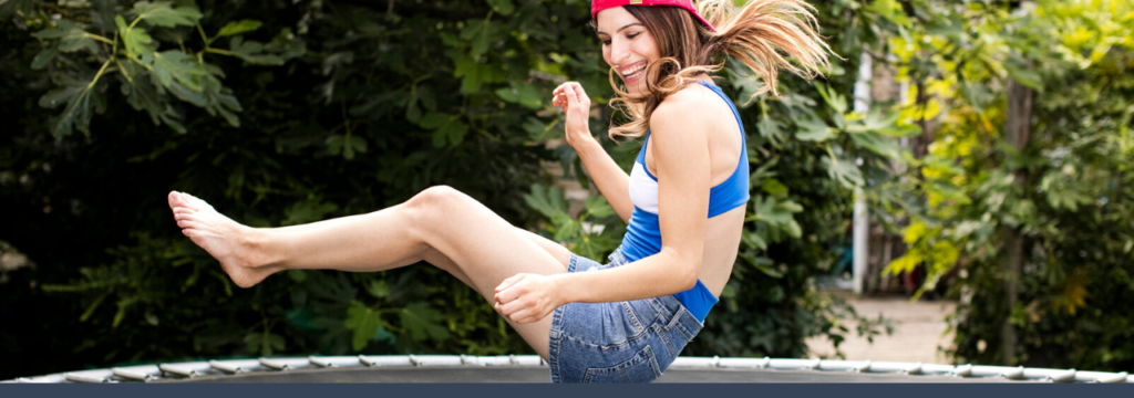 woman bouncing on trampoline